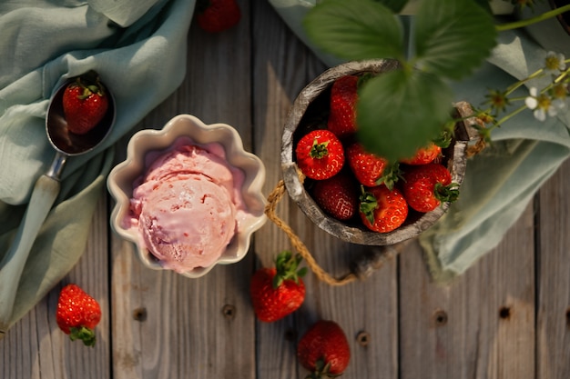 Strawberry ice cream balls with fresh strawberries in beautiful ice cream bowls