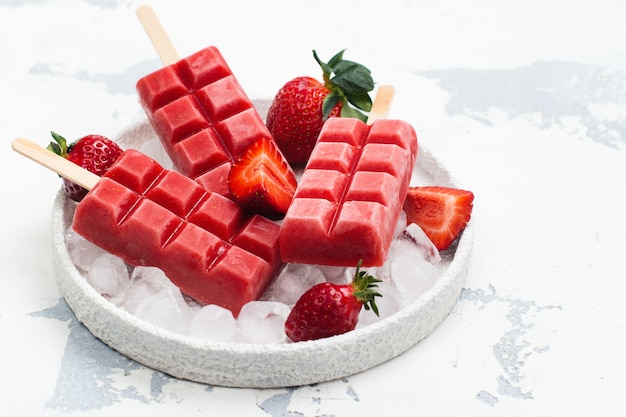 Strawberry ice cream popsicles