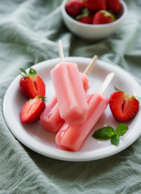 Strawberry ice cream popsicles