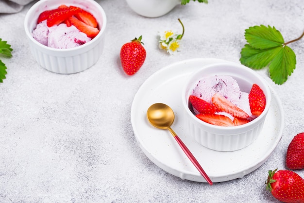 Strawberry ice cream in white bowl