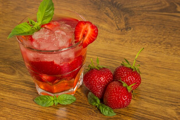 Strawberry iced drink in a wooden table