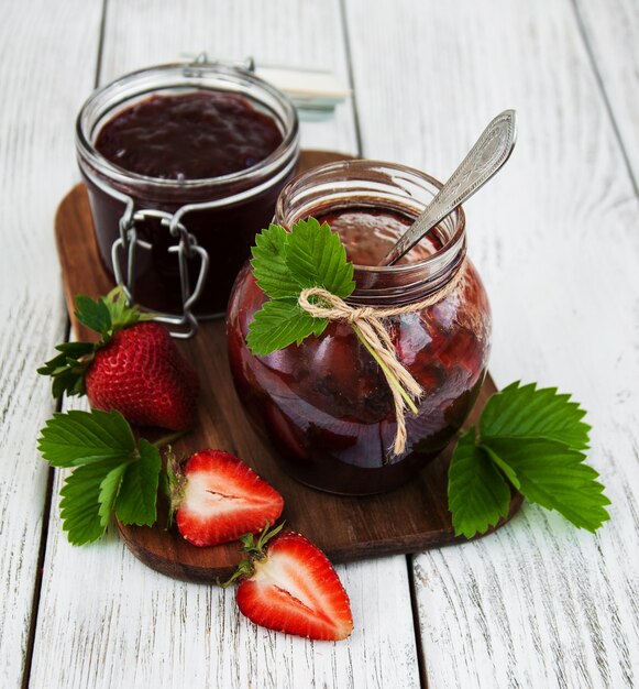 Strawberry jam and fresh strawberries