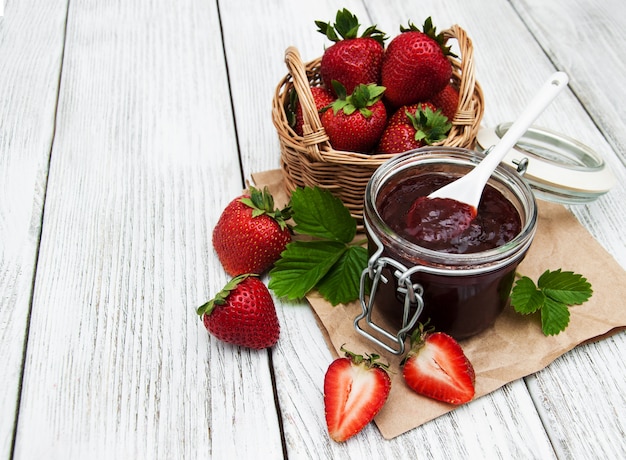 Strawberry jam and fresh strawberries