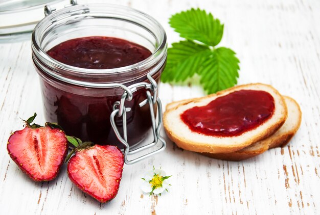 Strawberry jam and fresh strawberries