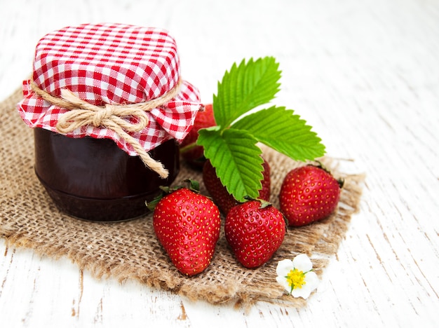 Strawberry jam and fresh strawberries