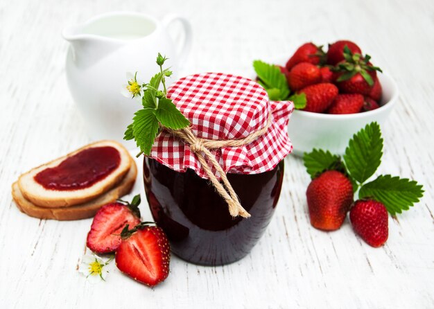 Strawberry jam and fresh strawberries