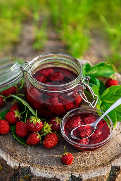 Strawberry jam in the garden Selective focus Food