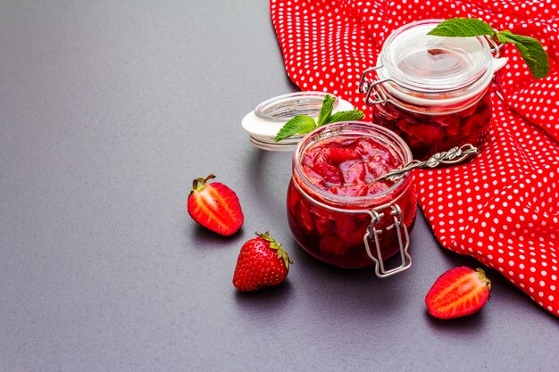 Strawberry jam in a glass jar.