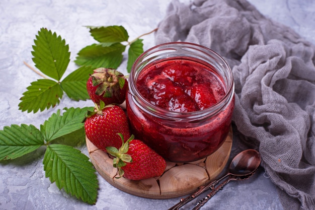 Strawberry jam in jar. Selective focus