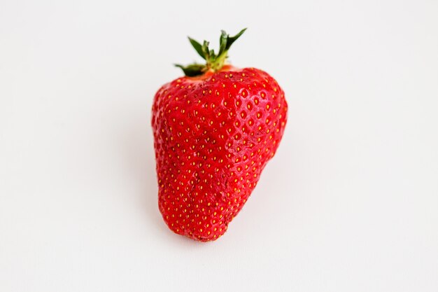 strawberry on a light background, ugly fruit