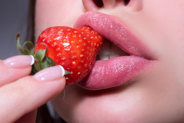 Strawberry in lips beauty mouth red strawberry in woman mouths close up