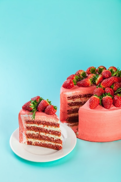 Strawberry mascarpone cake with fresh berries and rosemary leaves