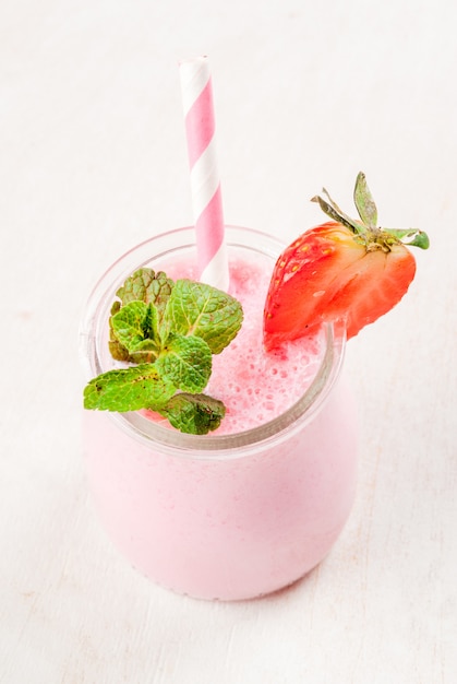 Strawberry milkshake with mint, in small jar