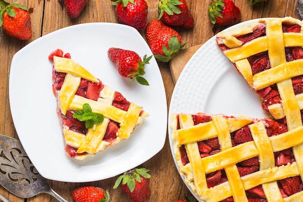 The strawberry pie in the wooden background