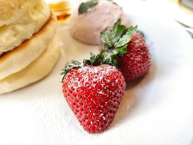 Strawberry on a plate colourful and summery great for food and beverage ads