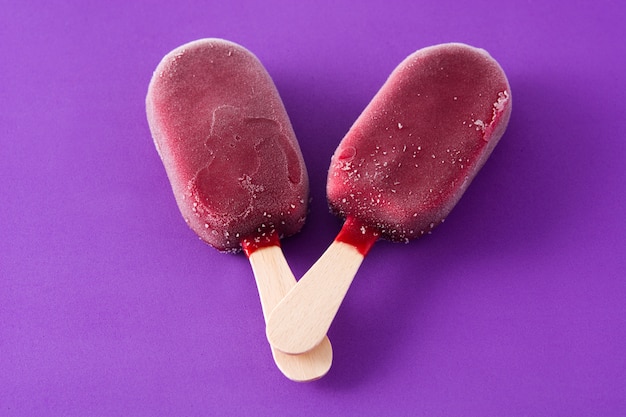 Strawberry popsicle on violet