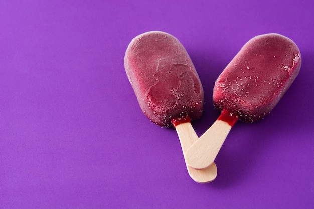 Strawberry popsicle on violet