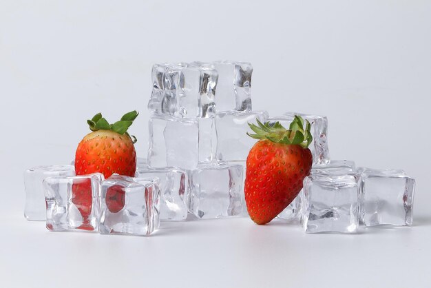 Strawberry read ice cube on white background