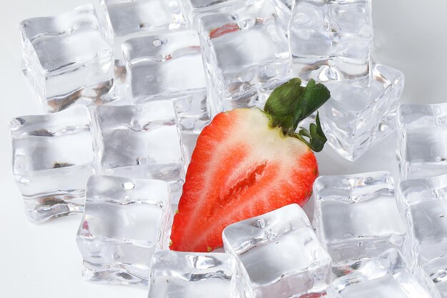 Strawberry read ice cube on white background