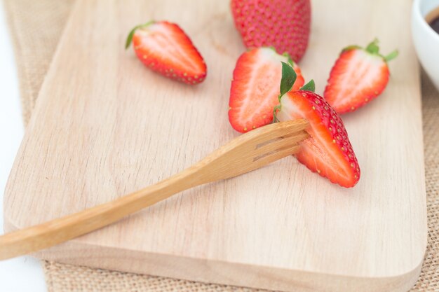 Strawberry on rustic wooden plate