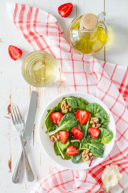 Strawberry salad in white bowl