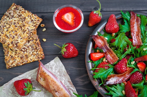 Strawberry salad with arugula, nuts, and honey