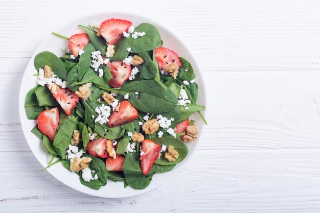 Strawberry salad with spinach cheese and walnut Healthy food