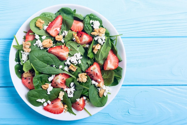 Strawberry salad with spinach cheese and walnut healthy food