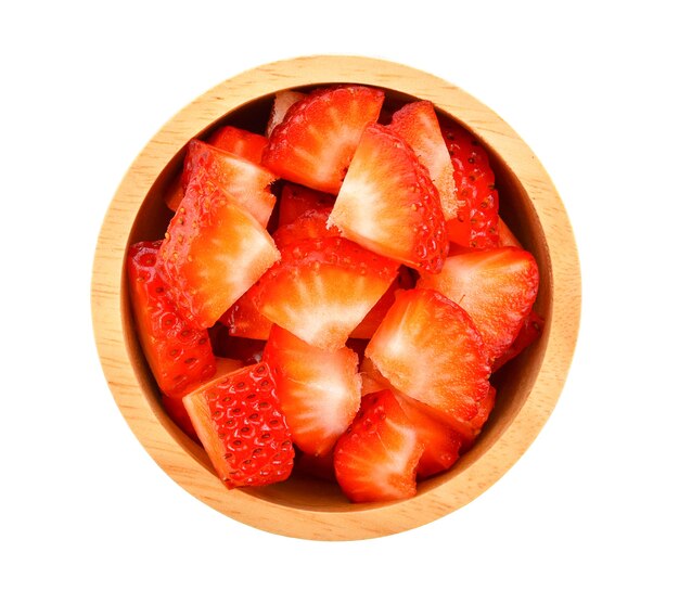 Strawberry slices in a wooden bowl