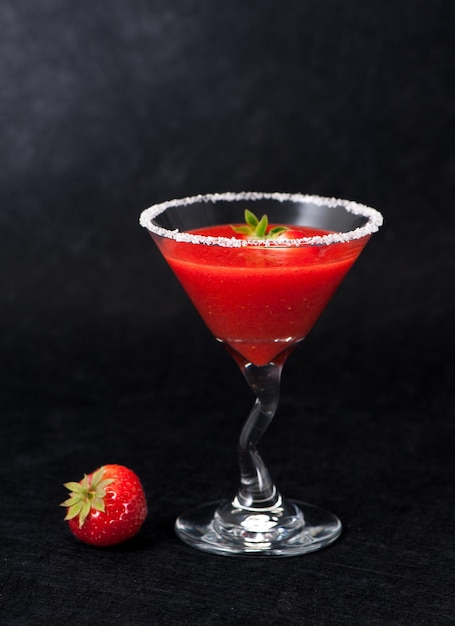 Strawberry smoothie in a glass goblet