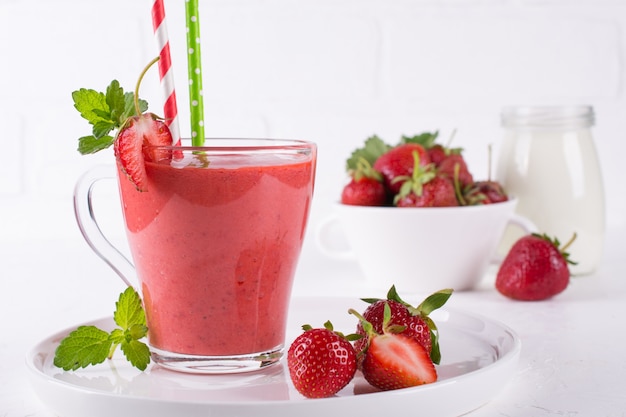 Strawberry smoothie with fresh berries. Healthy food for breakfast and snack