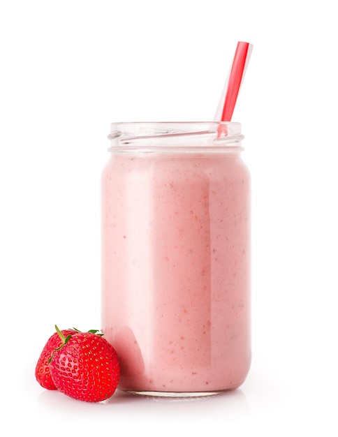 strawberry smoothie with straw in jar and fresh ripe strawberries near isolated on white background