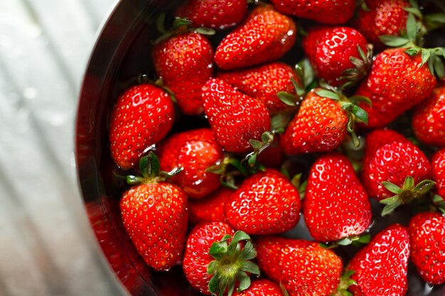 Strawberry soaking water in bowl