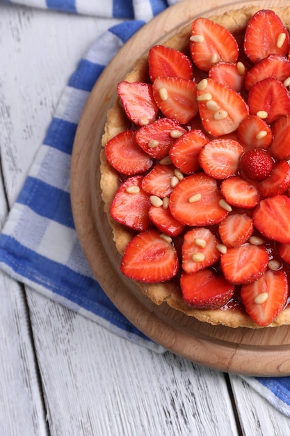 Strawberry tart on wooden tray