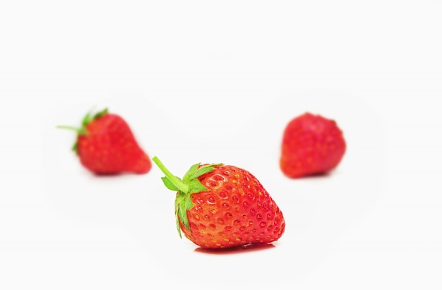 Strawberry on white wall