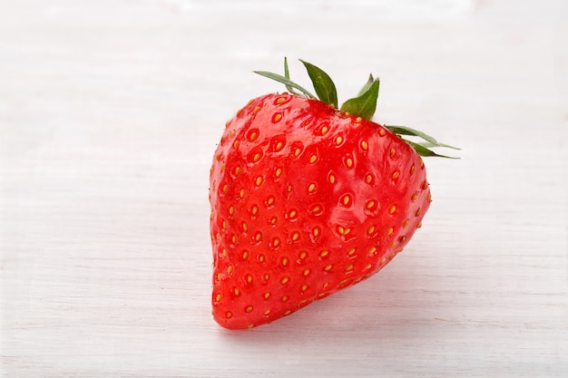 Strawberry on a white wooden table