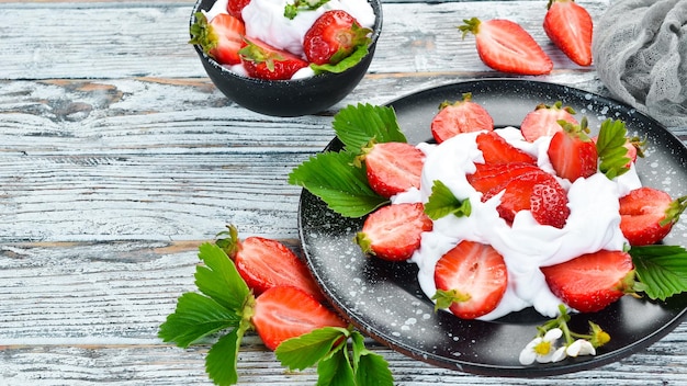 Strawberry with cream in a plate Dessert Berries Top view Free space for your text