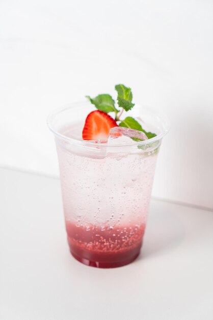 Strawberry with soda in glass