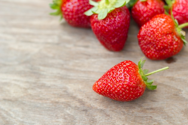 Strawberry on wood background