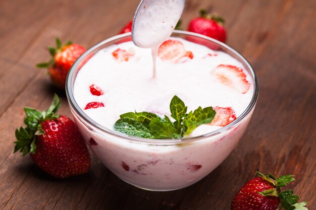 Strawberry yoghurt in a bowl on the table