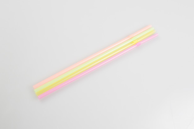 Photo straws for drinks on white background