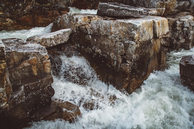 Stream of river among stones and rocks