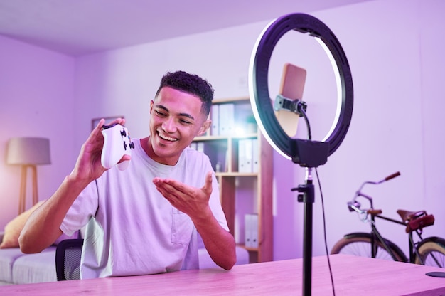 streamer live streaming and man gamer with review of console controller on social media for connection on vlog ring light influencer and content creator or person speaking on internet show as host