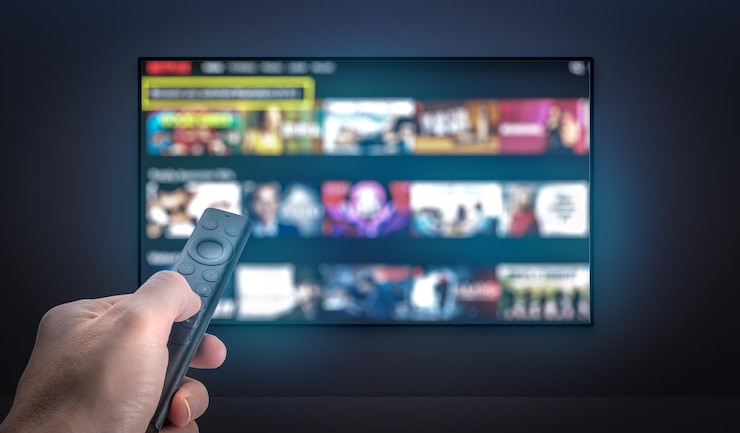 Photo streaming service watching online tv multimedia television video streaming choosing film to watch with remote subscription streaming video internet streaming service concept tv vod service