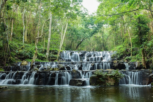 Streams of waterfalls flowing down from the top of the mountain