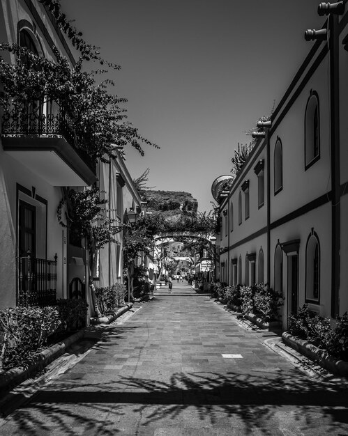 Street amidst buildings against sky