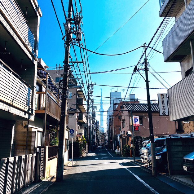 Street amidst buildings in city against sky