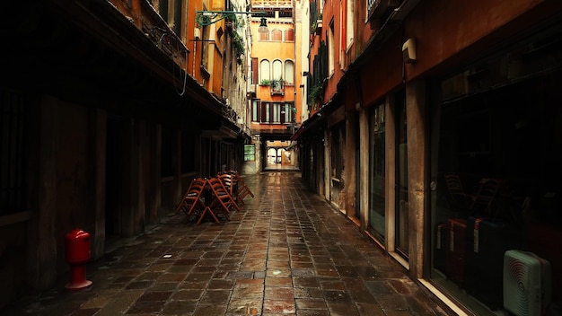 Street amidst buildings at evening