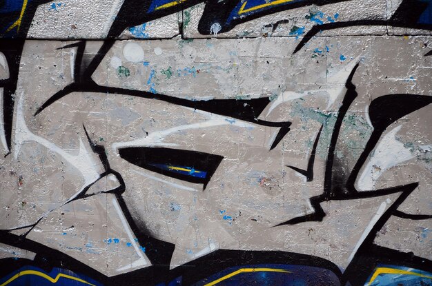 Photo street art abstract background image of a fragment of a colored graffiti painting in chrome and blue tones