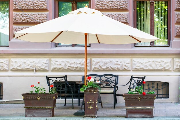 Street cafe under the big umbrella